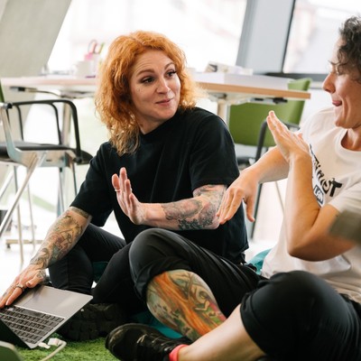 Two participants in conversation at the Feminist AI LAN Party
